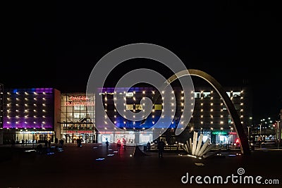 Exterior view of shopping centre Galeria Krakowska and modern Arch at night Editorial Stock Photo