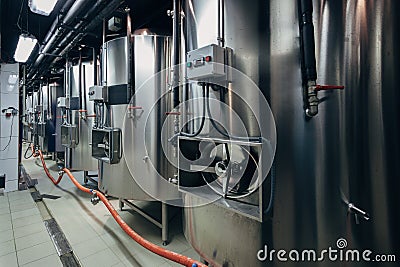 Craft beer production line in private microbrewery. Maturation tanks Stock Photo