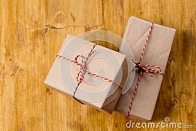 Craft christmas presents on wooden background Stock Photo