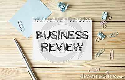 Craft colour notepad with text BUSINESS REVIEW. documents. Business concept Stock Photo