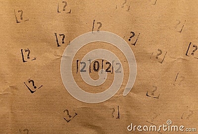 craft paper with 2022 and many stamped questions marks Stock Photo