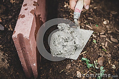 Craftman building a stair with a bricklayer and cement Stock Photo