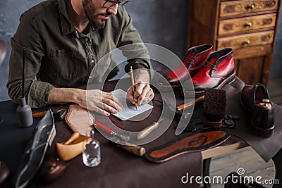 Craftman planning the working day Stock Photo