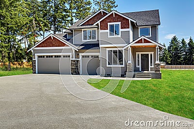 Craftsman American house with rocks trim, garage and concrete floor porch Stock Photo
