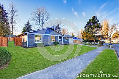 Craftsman blue one-story low-pitched roof home in Tacoma. Stock Photo