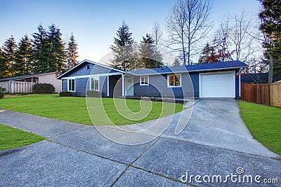 Craftsman blue one-story low-pitched roof home in Tacoma. Stock Photo