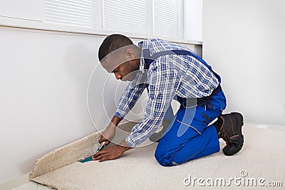 Craftsman Fitting Carpet Stock Photo