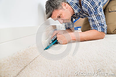 Craftsman fitting carpet Stock Photo