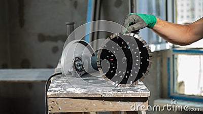 Craftsman holding a circular diamond disc. Stock Photo