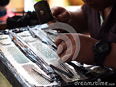 Craftsman jewellery maker working on cultural traditional style artistic handcraft Stock Photo