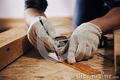 Craftsman measuring plank Stock Photo