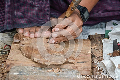 Craftsman profession in myanmar, working with wood statue and carving with tools in Stock Photo