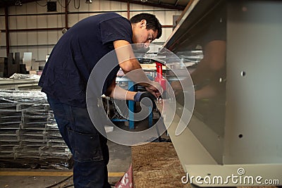 Craftsman rivet metal in workshop.construction or installation of skylights Stock Photo