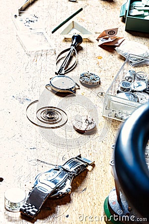 Craftsman's table displays intricate watchmaking, vintage ambian Stock Photo