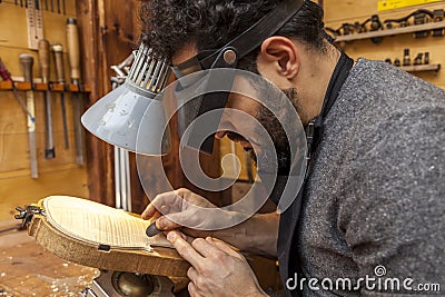 Craftsman violinmaker began working on a new violin Stock Photo