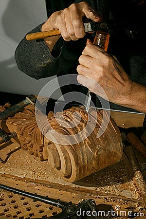 Craftsman& x27;s hands working on wood carving, with gouge and chisel Cabinetmaker, carpentry Stock Photo