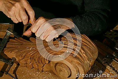 Craftsman& x27;s hands working on wood carving, with gouge and chisel Cabinetmaker, carpentry Stock Photo