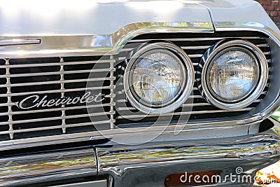 Monterey, CA, USA - 18 Aug 2022: Macro, twin headlamps on an antique Chevrolet during Classic Car Week. Editorial Stock Photo