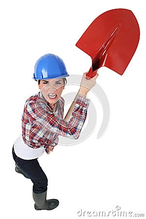 Craftswoman holding a shovel Stock Photo