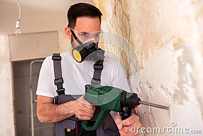 Crafty worker removing porcelain tiles Stock Photo