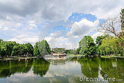 Craiova, Romania, 28 May 2022: Vivid landscape in Nicolae Romaescu park in Dolj county, with lake, waterlillies and large green Editorial Stock Photo