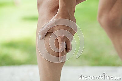 Cramp in leg calf during sports activity Stock Photo