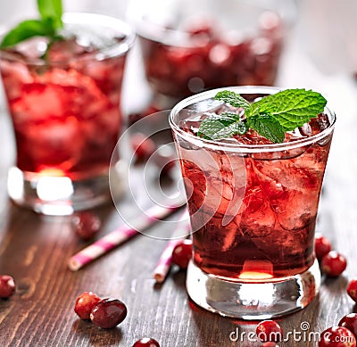 Cranberry cocktail with mint garnish. Stock Photo