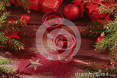 Cranberry vodka shot and Christmas decorations Stock Photo