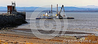 A crane barge in Saint Laurent Editorial Stock Photo