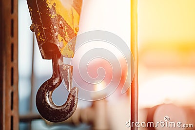 Crane chain and hook with blurred warehouse background. Concept production steel factory Stock Photo