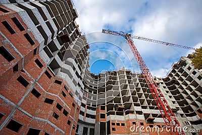 Crane construction bricks concrete building in city Stock Photo