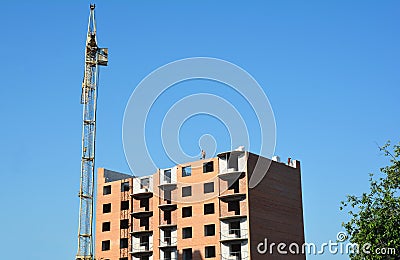 Crane construction with unfinished building and working contract Editorial Stock Photo