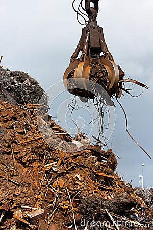 Crane grabber loading metal scrap Stock Photo