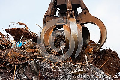 Crane grabber loading metal scrap Stock Photo