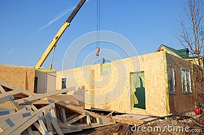 Crane Install SIP panels for Frame House Construction Stock Photo