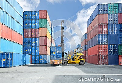 Crane lifter handling container box loading to truck Stock Photo
