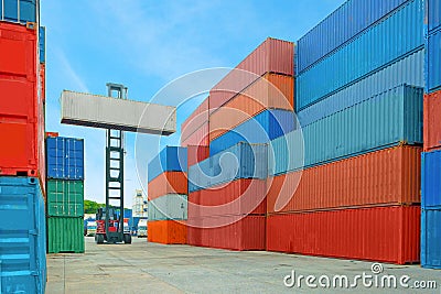 Crane lifter handling container box loading to truck Stock Photo