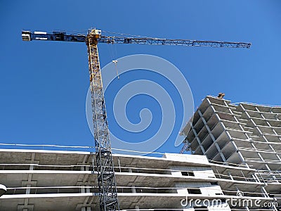 Crane over modern building Stock Photo