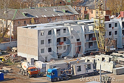 Crane part, truck with slabs on construction site Stock Photo