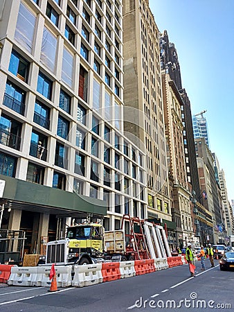 Stopping Traffic, Crane Lifting Construction Material Above Pedestrians, Manhattan, NYC, NY, USA Editorial Stock Photo