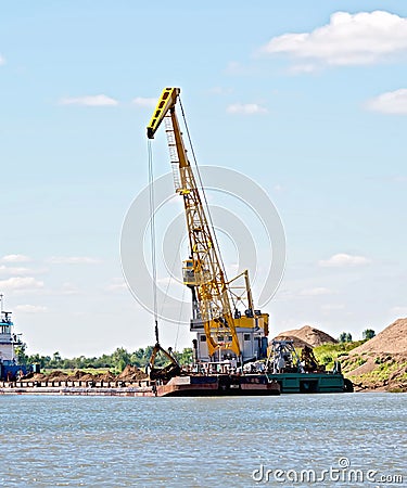 Crane river with barge Stock Photo