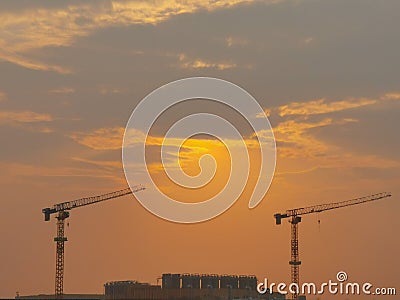 Crane sunrise Industrial factory construction Stock Photo