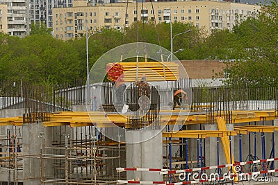The crane supplies blanks for formwork to builders Editorial Stock Photo