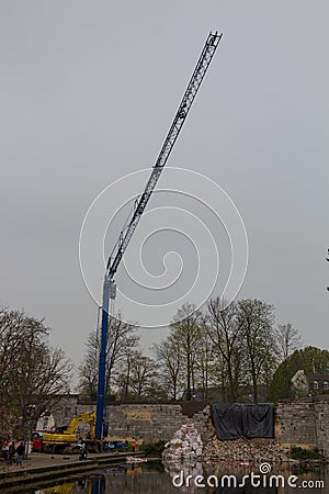 Crane truck helping to rescue collapsed wall Editorial Stock Photo