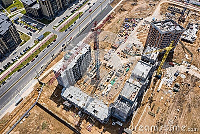 crane working on under construction high-rise residential complex. aerial view Stock Photo