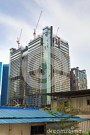 cranes at skyscraper construction site Stock Photo