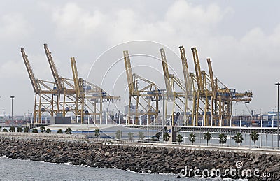 Cranes to load and unload cargo freighters in barcelona port Editorial Stock Photo