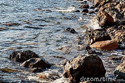 Crash of waves. Hectic sea. Summer vibe. Ocean landscape. Virgin nature or Freedom. Seasonal vacation. Rocky coastline Stock Photo