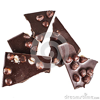 Crashed blach chocolate bar with large hazelnuts Stock Photo