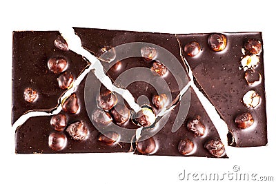 Crashed blach chocolate bar with large hazelnuts Stock Photo